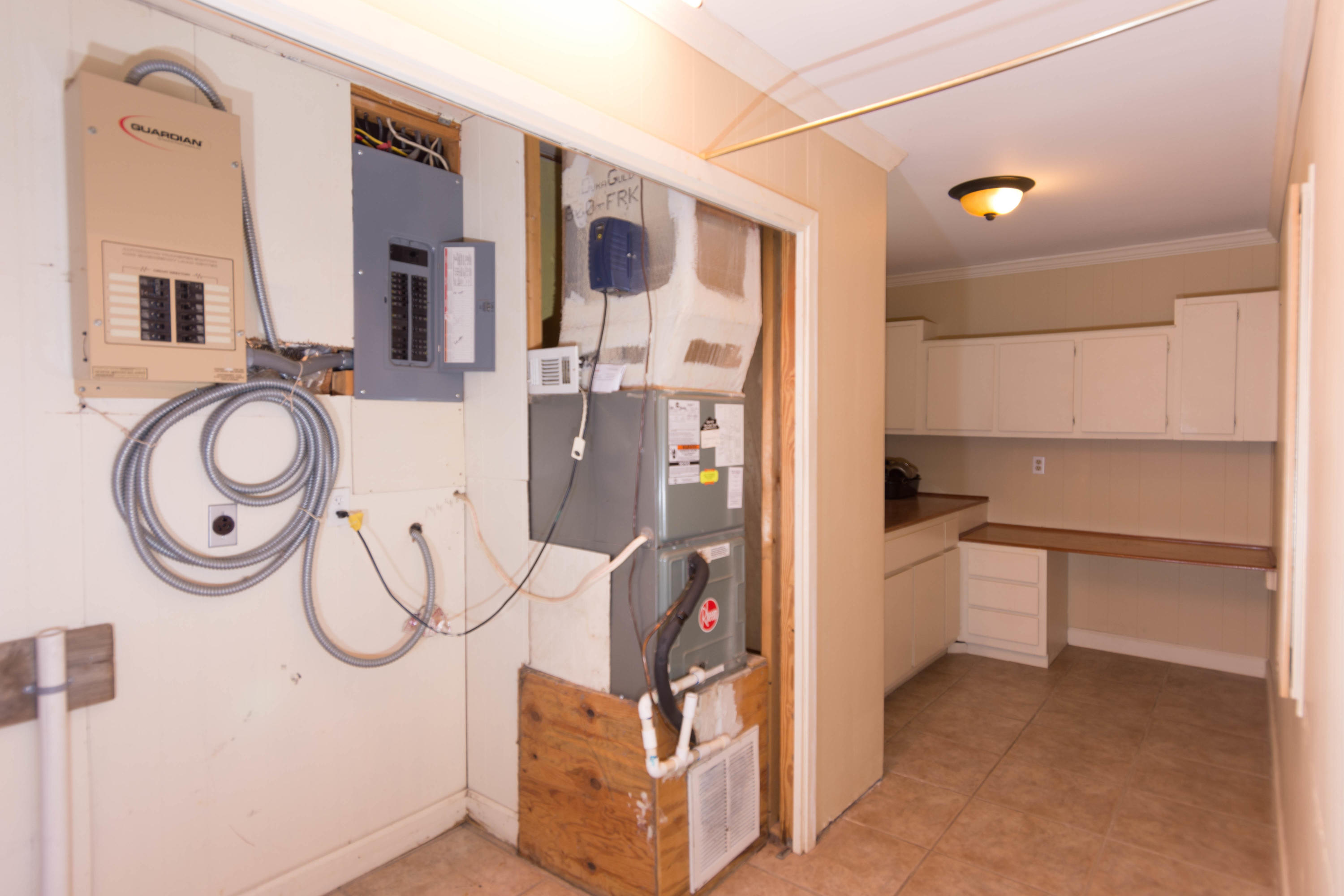 2292 Bay Grove Road Freeport, FL 32439 - Photo 11 of 47 a kitchen with a refrigerator and cabinets