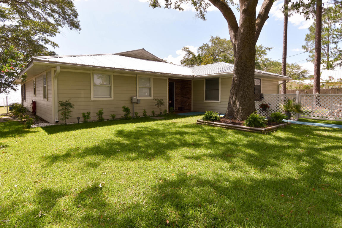 2292 Bay Grove Road Freeport, FL 32439 - Photo 14 of 47 a front view of a house with a yard