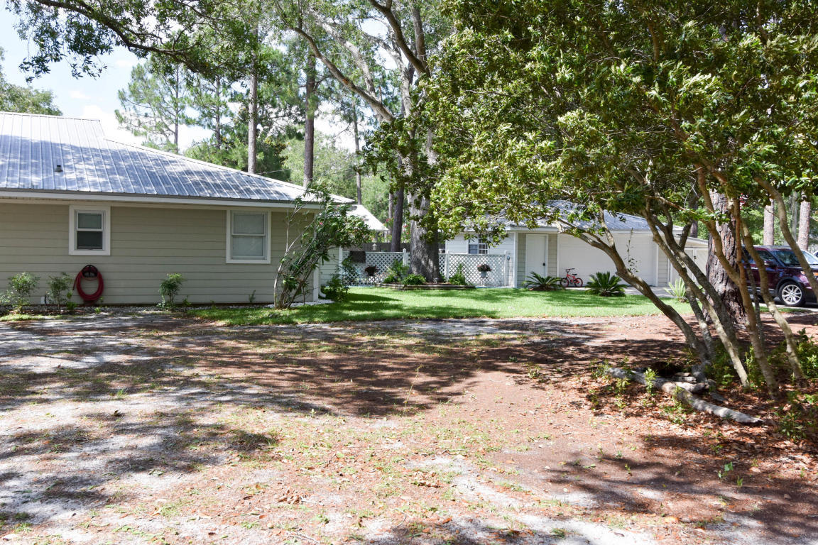 2292 Bay Grove Road Freeport, FL 32439 - Photo 19 of 47 a view of a house with a yard