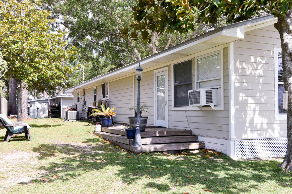 2292 Bay Grove Road Freeport, FL 32439 - Photo 36 of 47 a view of a house with a yard and sitting area