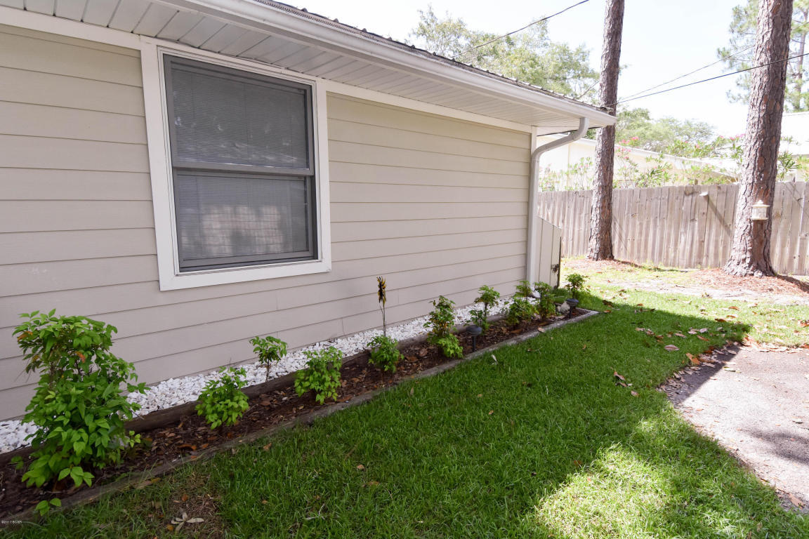 2292 Bay Grove Road Freeport, FL 32439 - Photo 42 of 47 a view of a backyard with plants and large tree