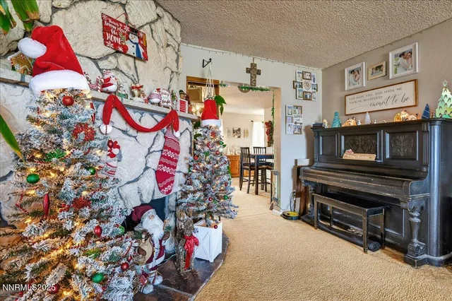 a large bed sitting in a bedroom next to a window