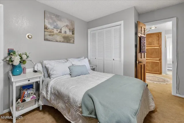 a utility room with cabinets washer and dryer