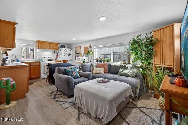 a kitchen with stainless steel appliances granite countertop a sink and cabinets