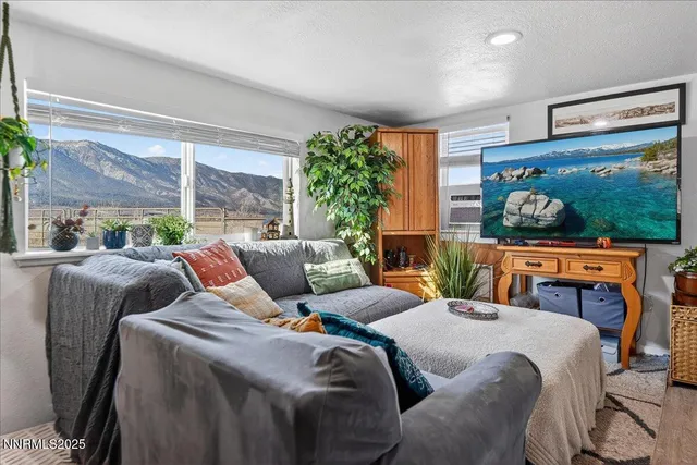 a spacious bedroom with a bed and a window in it