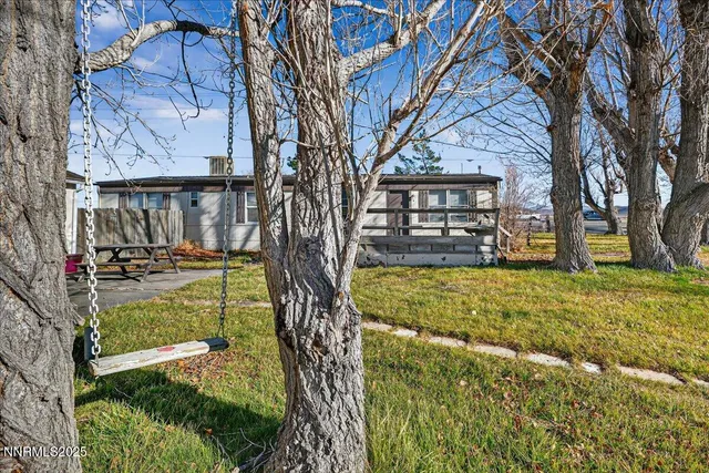 a aerial view of a house with a yard and a terrace