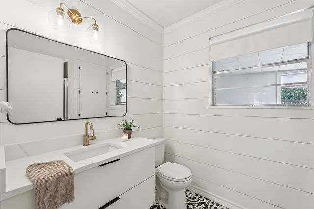 a bathroom with a sink and mirror