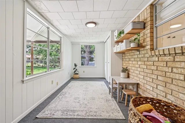 a view of a big room with windows