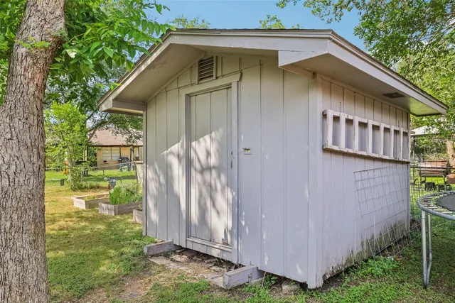 a backyard of a house with plants and garden