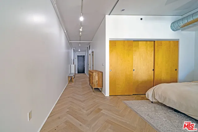 a bedroom with a bed and a view of bathroom