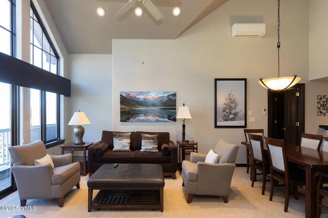 a living room with furniture a lamp and a fireplace