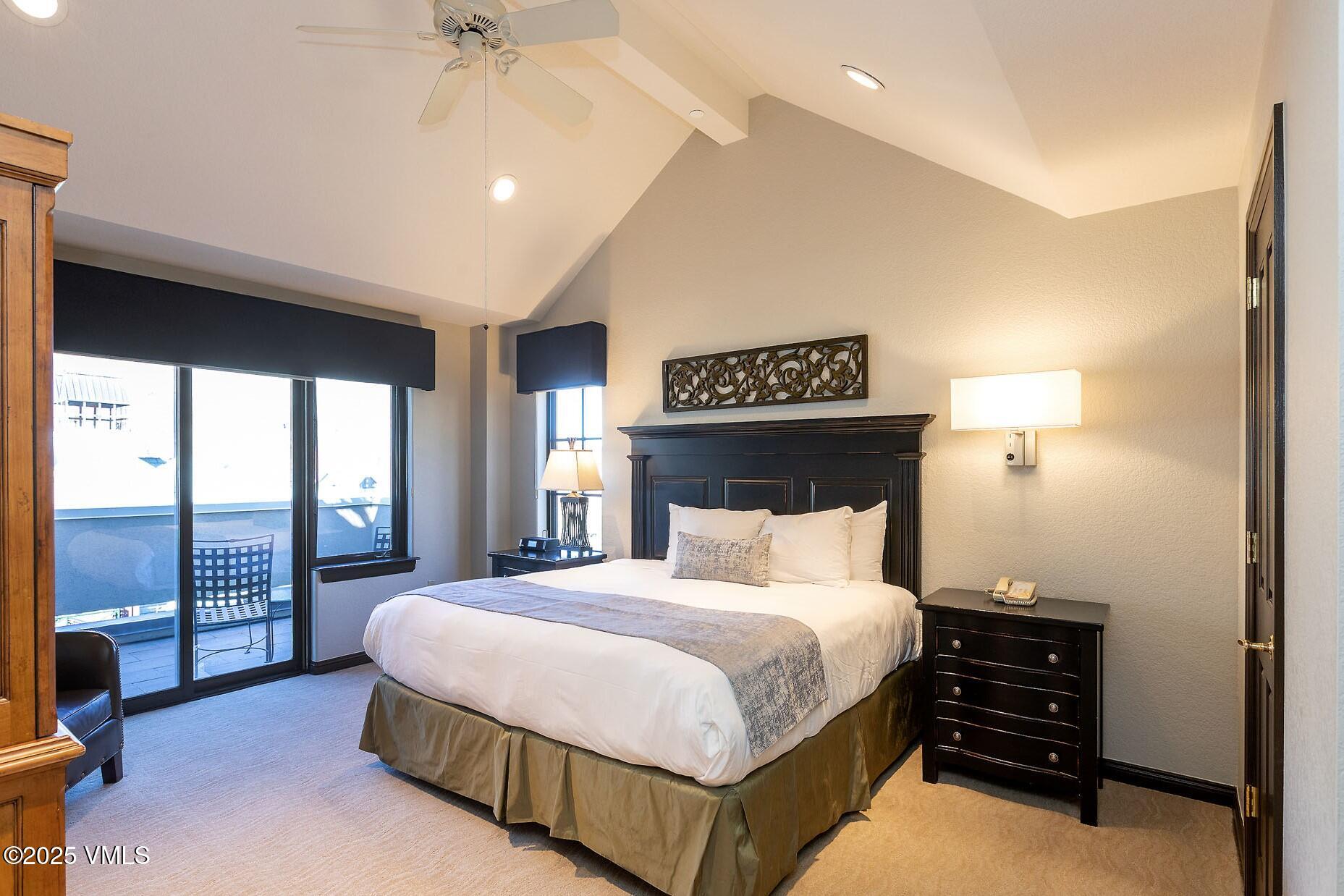 210 Offerson Road, Unit R203 WEEK 14 Beaver Creek, CO 81620 - Photo 11 of 31 a bedroom with a bed and a large window