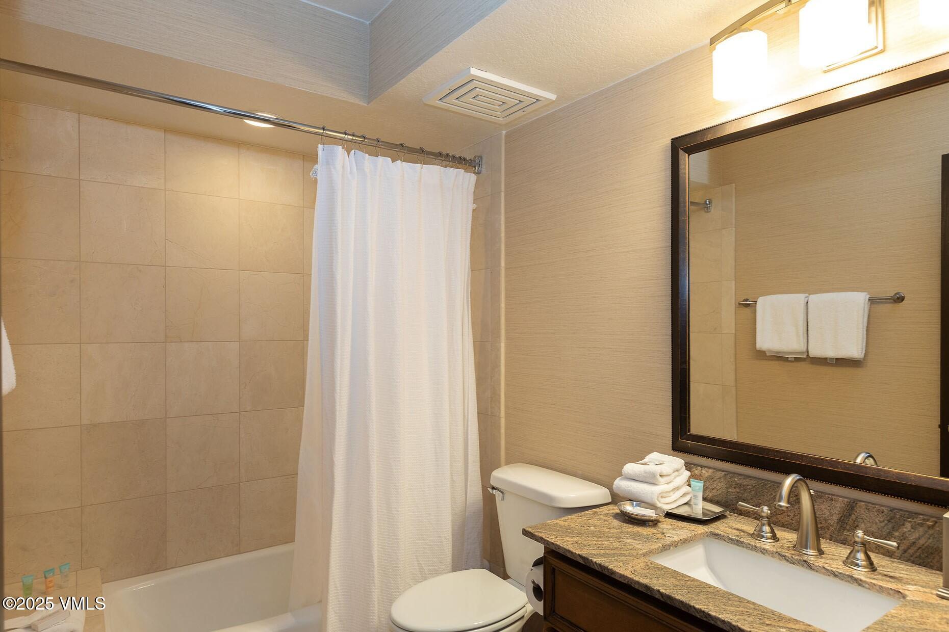 210 Offerson Road, Unit R203 WEEK 14 Beaver Creek, CO 81620 - Photo 16 of 31 a bathroom with a granite countertop sink toilet and shower