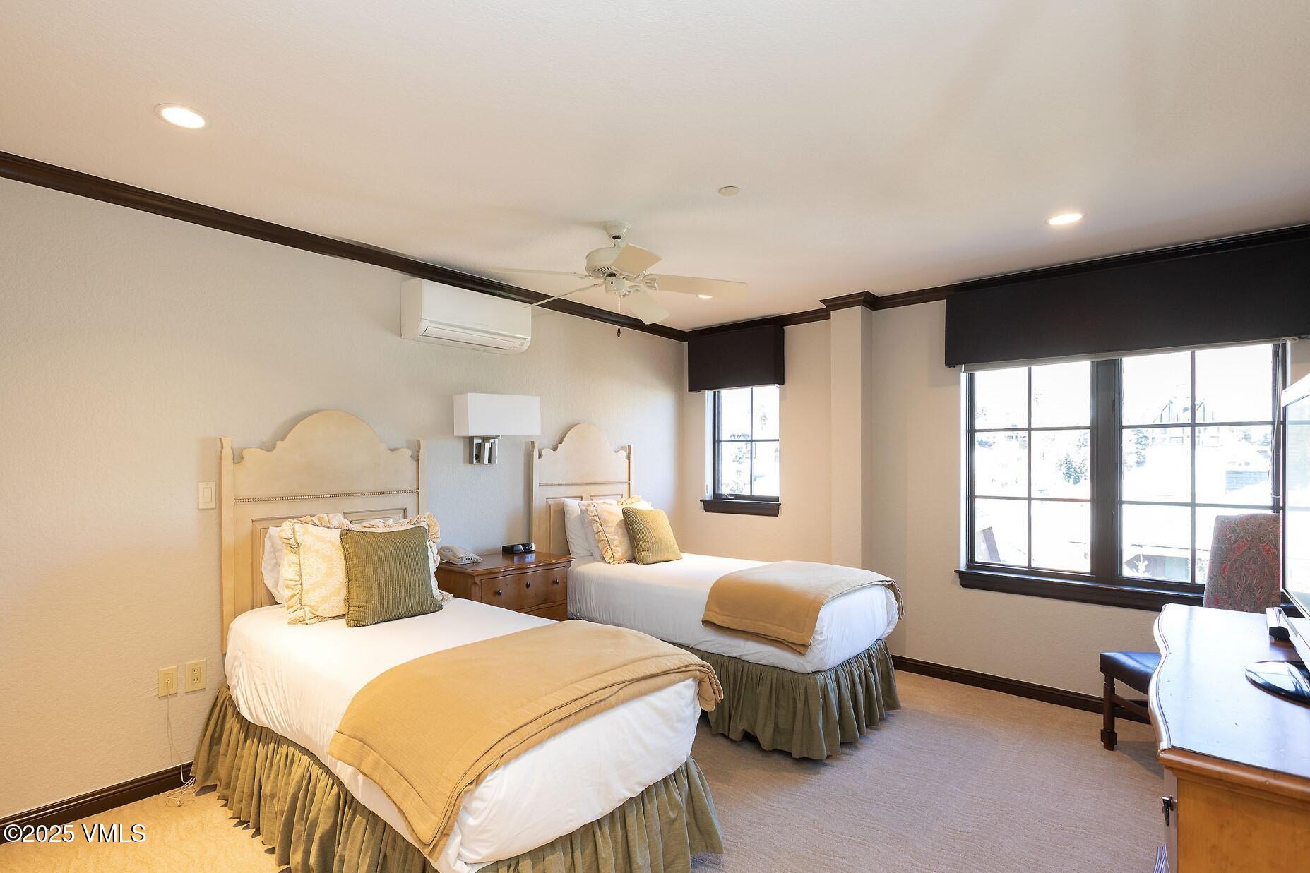 210 Offerson Road, Unit R203 WEEK 14 Beaver Creek, CO 81620 - Photo 17 of 31 a bedroom with two beds and a large window