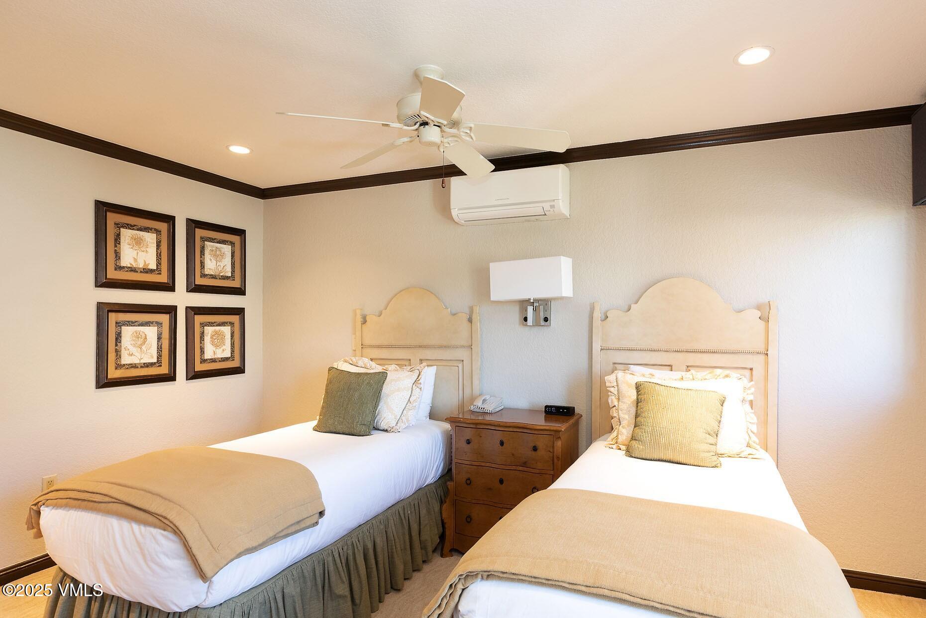 210 Offerson Road, Unit R203 WEEK 14 Beaver Creek, CO 81620 - Photo 18 of 31 a bedroom with a bed and a painting on the wall