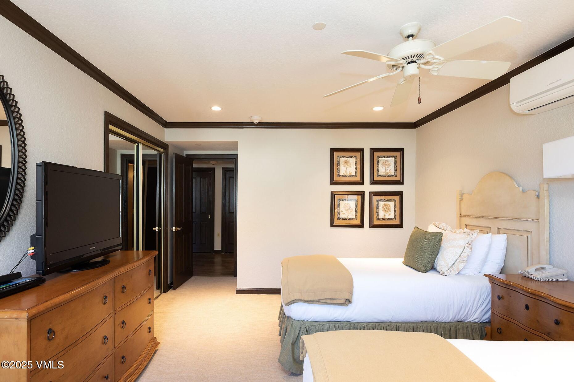 210 Offerson Road, Unit R203 WEEK 14 Beaver Creek, CO 81620 - Photo 19 of 31 a bedroom with a bed and a flat screen tv