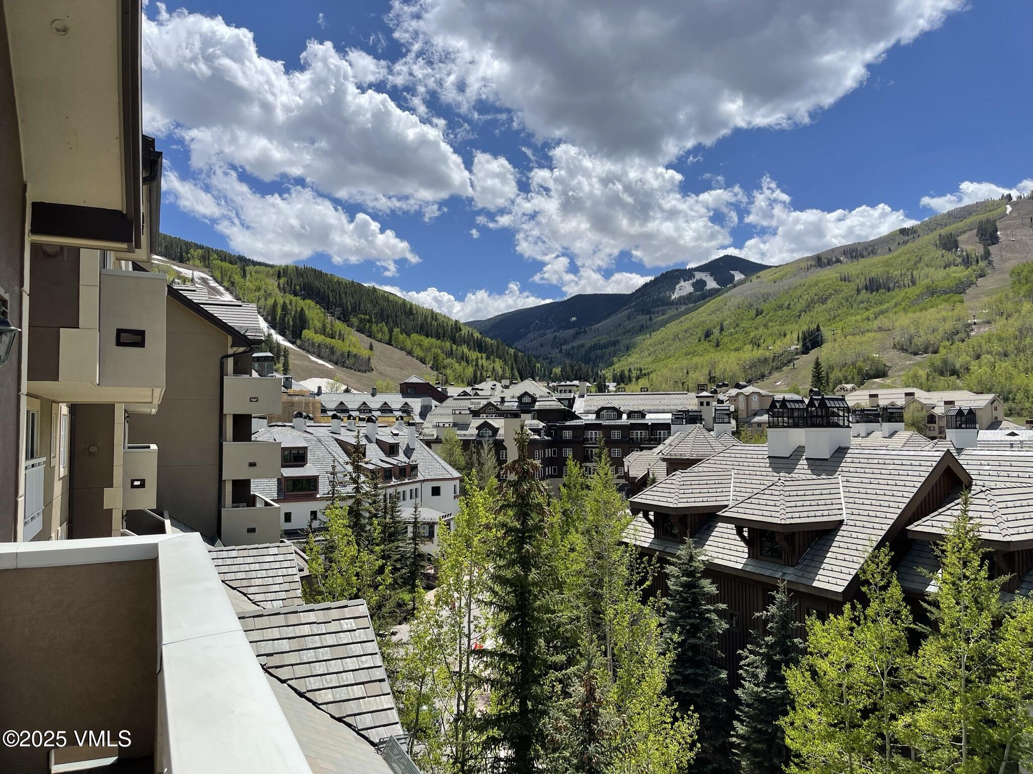 210 Offerson Road, Unit R203 WEEK 14 Beaver Creek, CO 81620 - Photo 2 of 31 a view of a patio with plants and a fountain