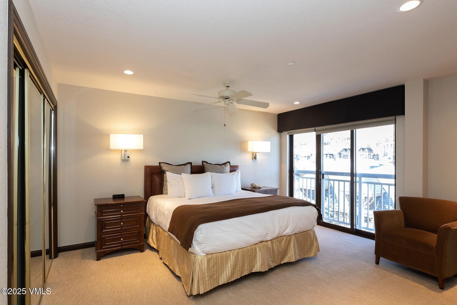 210 Offerson Road, Unit R203 WEEK 14 Beaver Creek, CO 81620 - Photo 22 of 31 a bedroom with a bed and a large window