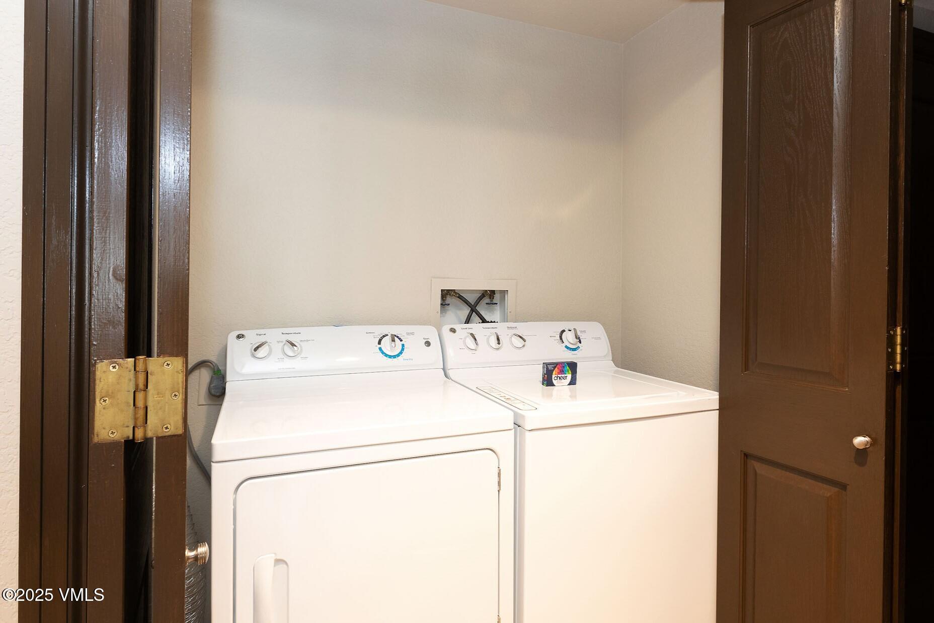210 Offerson Road, Unit R203 WEEK 14 Beaver Creek, CO 81620 - Photo 25 of 31 a utility room with dryer and washer