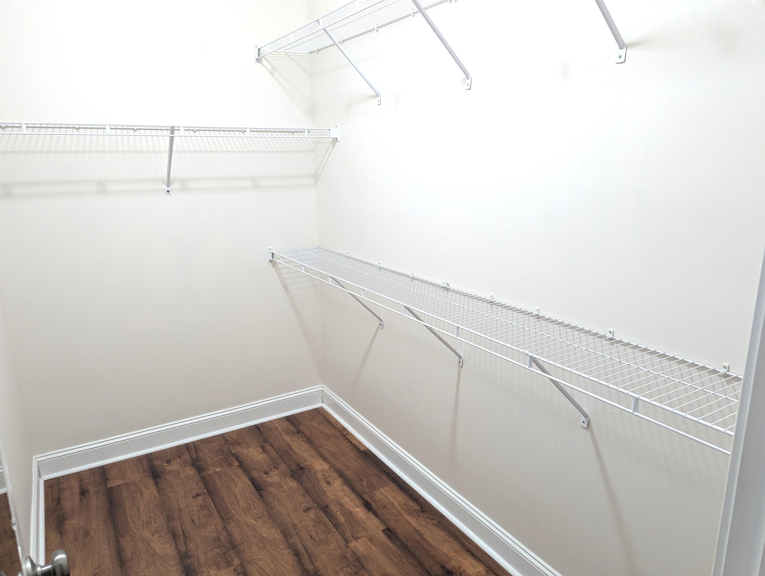 1100 Eureka Trail Longs, SC 29568 - Photo 16 of 40 Spacious closet with dark wood finished floors