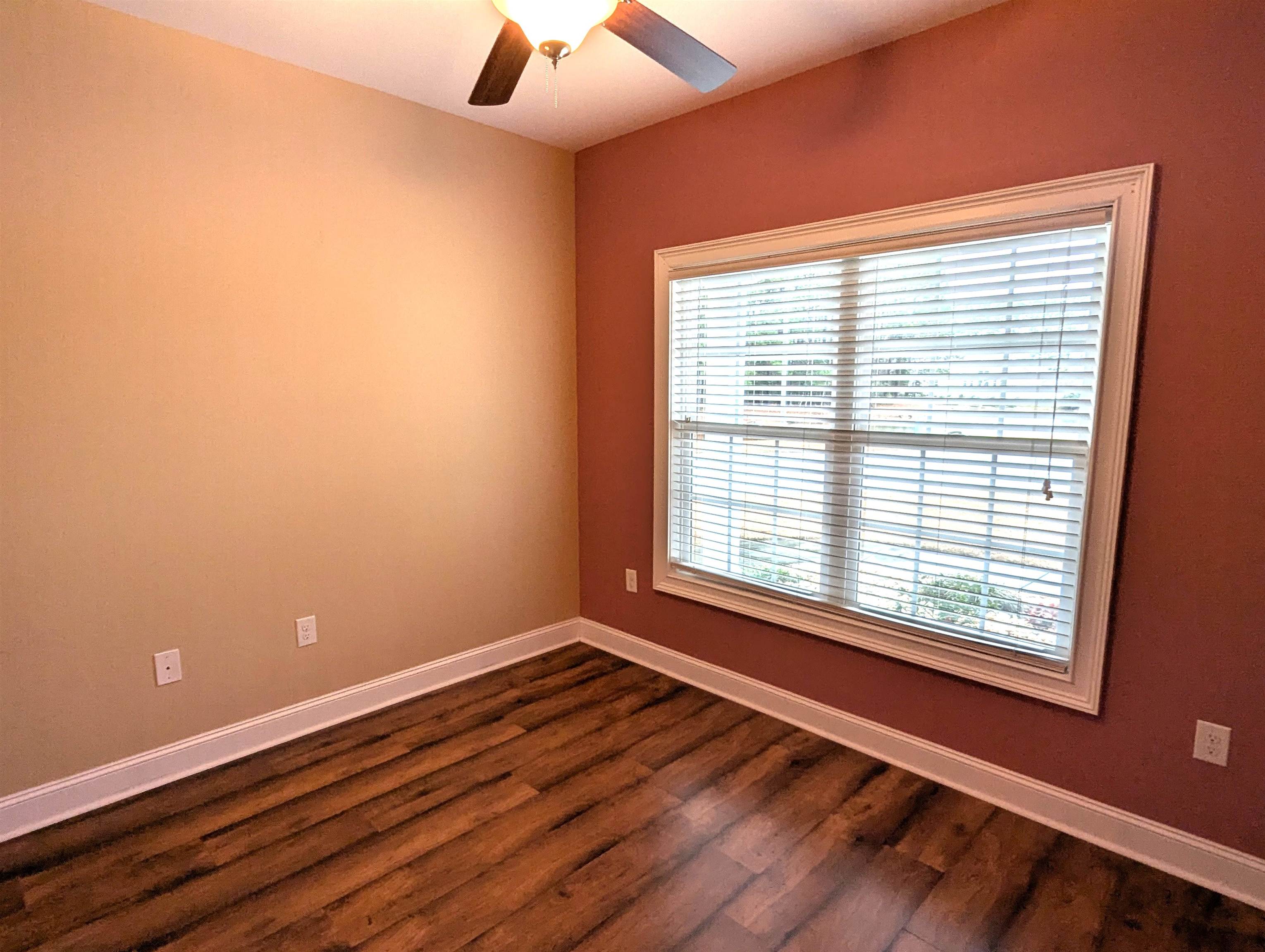 1100 Eureka Trail Longs, SC 29568 - Photo 19 of 40 Unfurnished room with dark wood-type flooring and ceiling fan