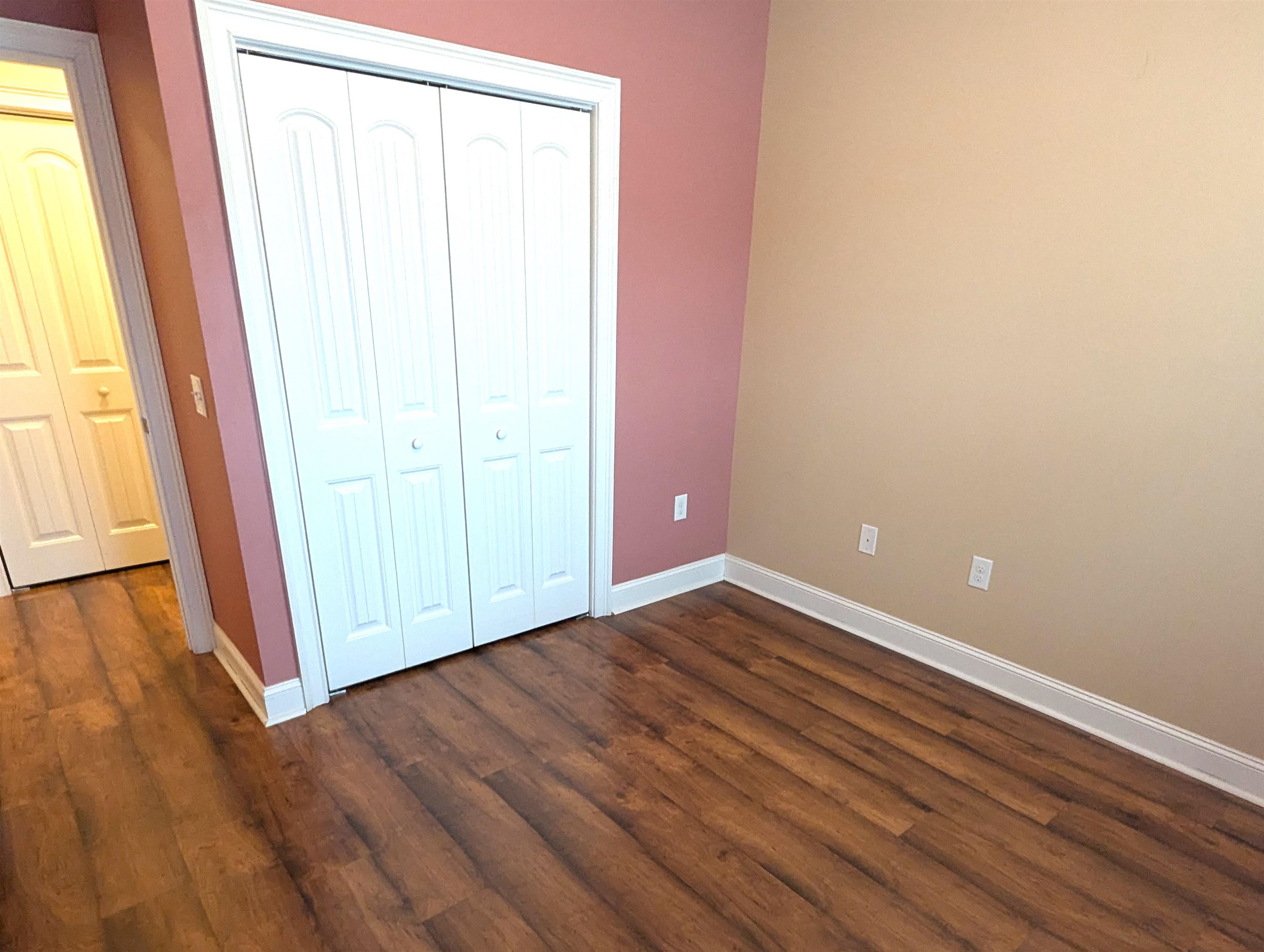 1100 Eureka Trail Longs, SC 29568 - Photo 20 of 40 Unfurnished bedroom featuring a closet and dark wood-type flooring