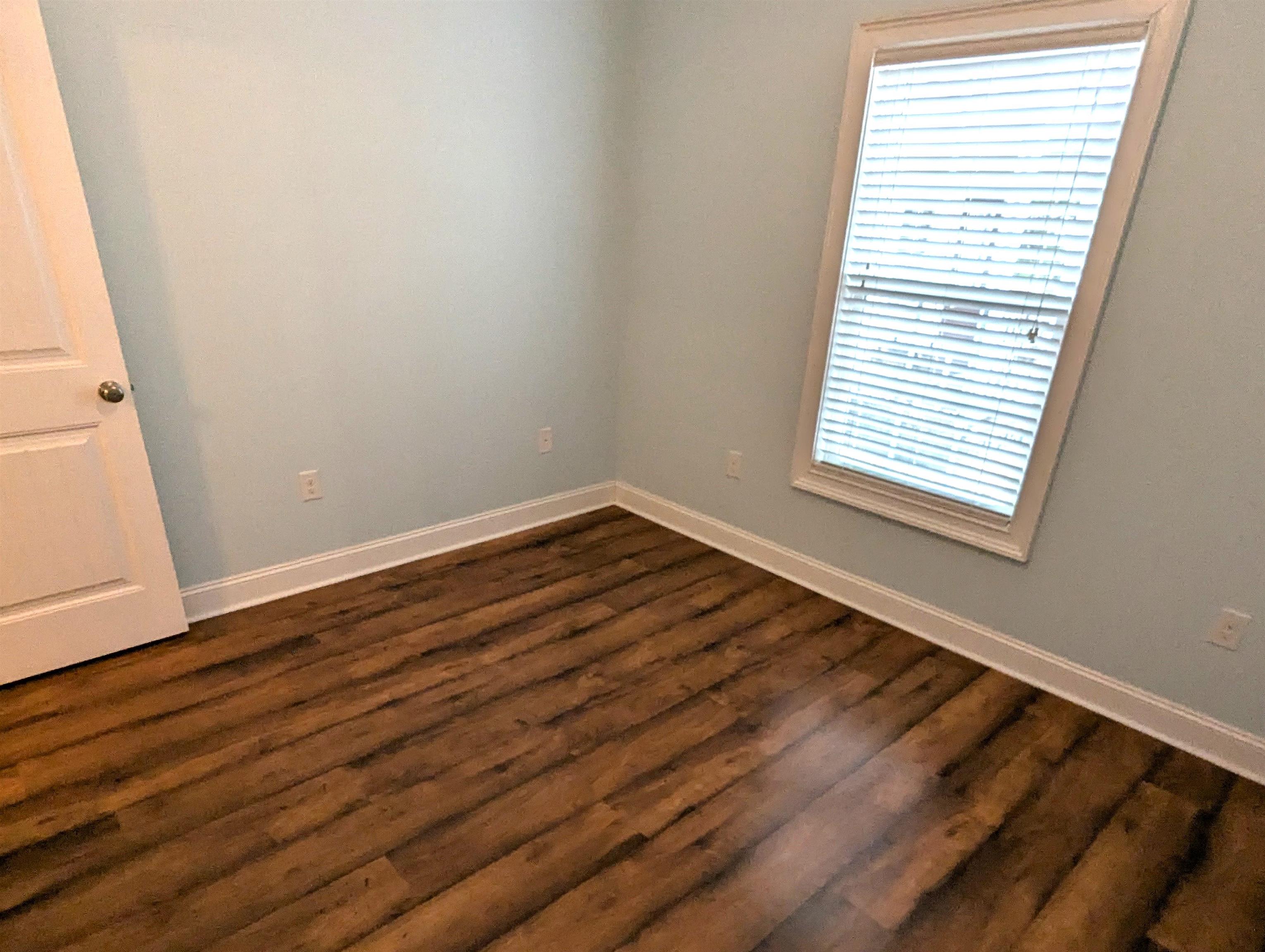 1100 Eureka Trail Longs, SC 29568 - Photo 22 of 40 Spare room featuring dark wood-style flooring and baseboards