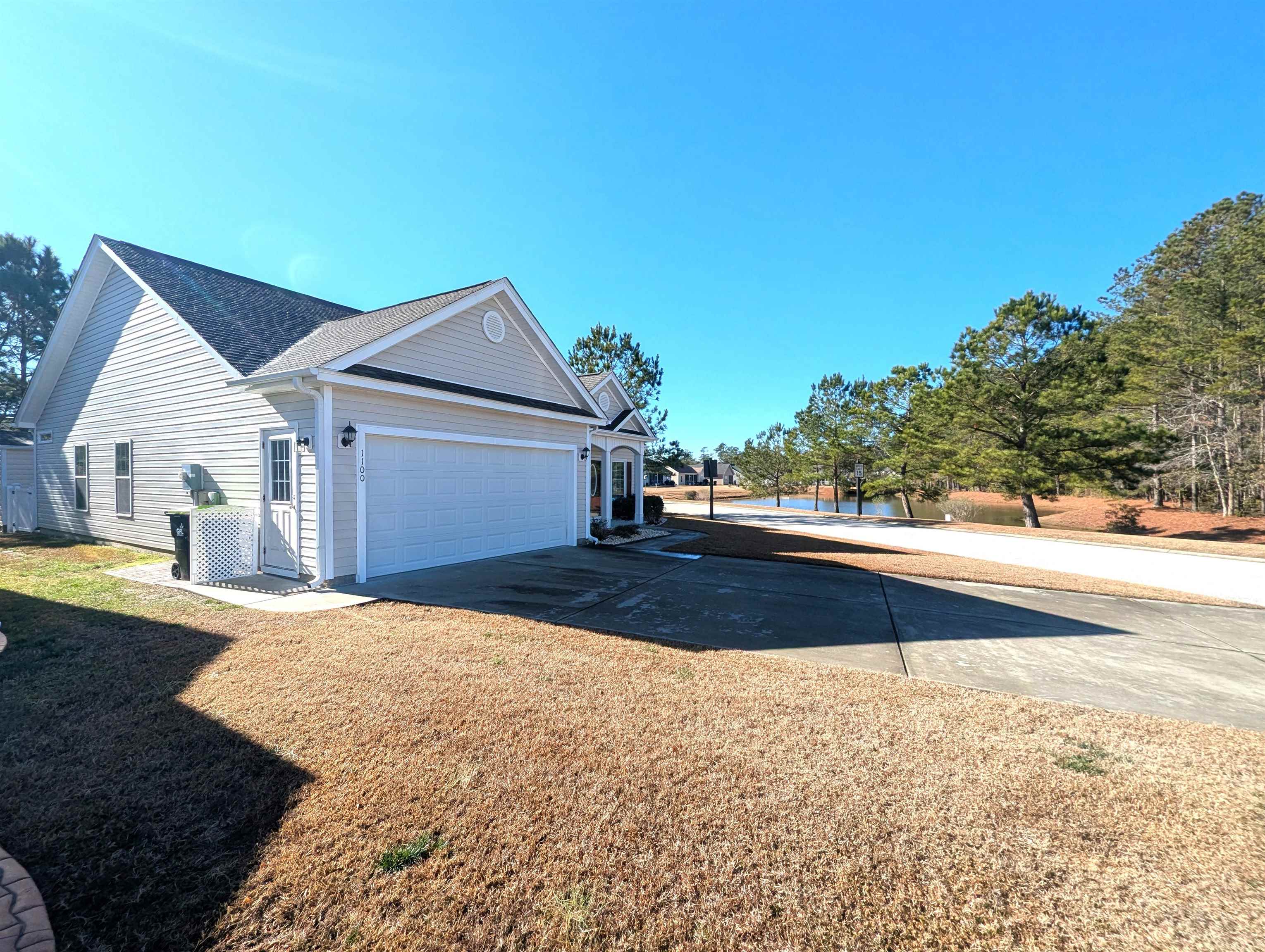 1100 Eureka Trail Longs, SC 29568 - Photo 34 of 40 View of home's exterior with concrete driveway and an attached garage