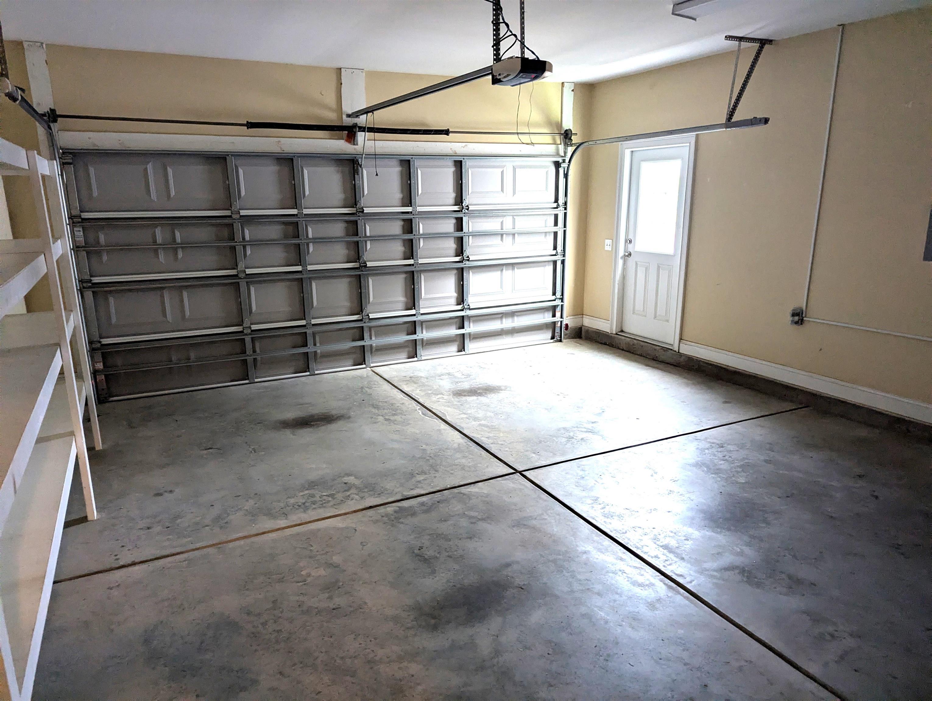 1100 Eureka Trail Longs, SC 29568 - Photo 35 of 40 Garage with baseboards and a garage door opener