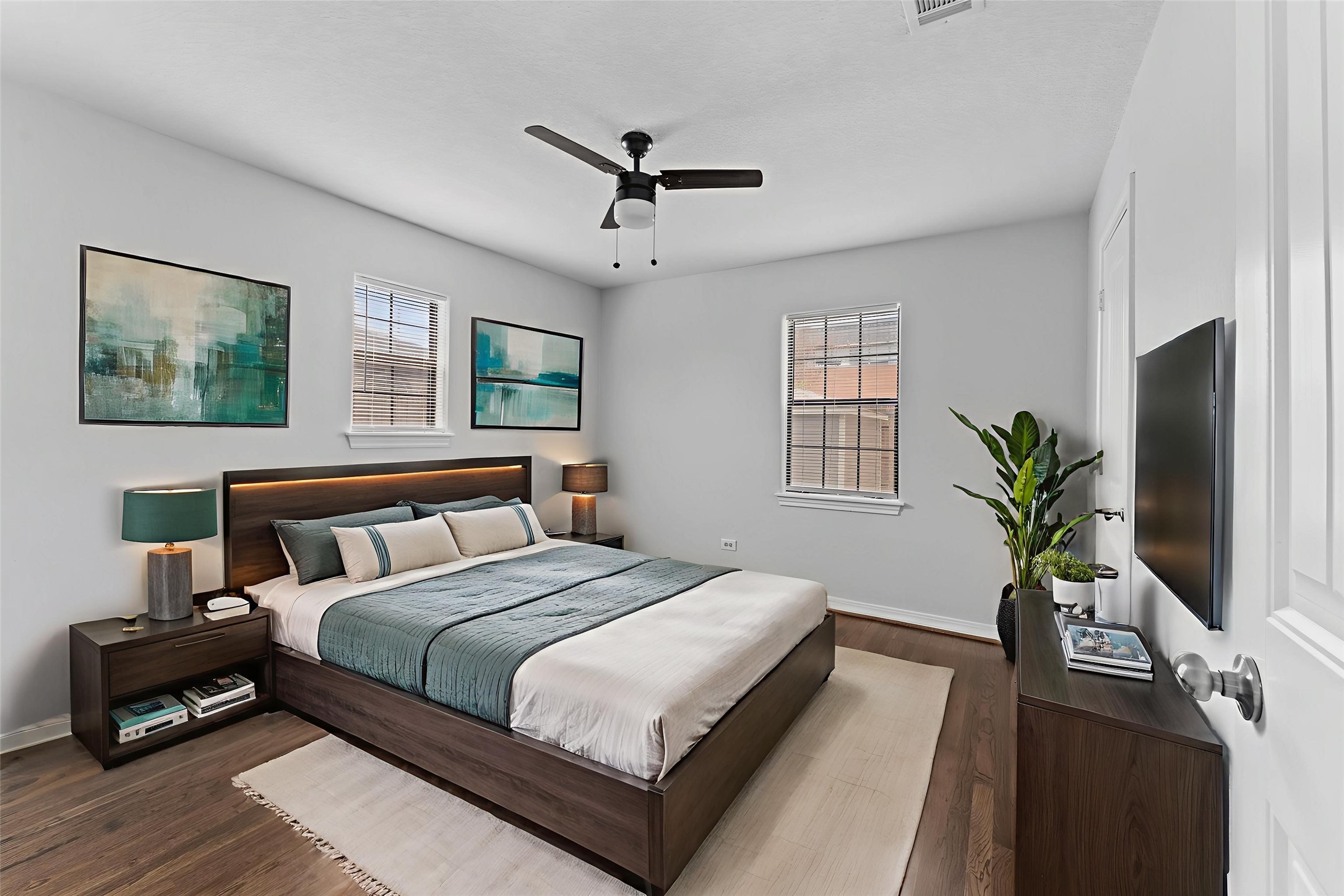 2024 Jean Street Houston, TX 77204 - Photo 3 of 23 a bedroom with bed a couch and a potted plant