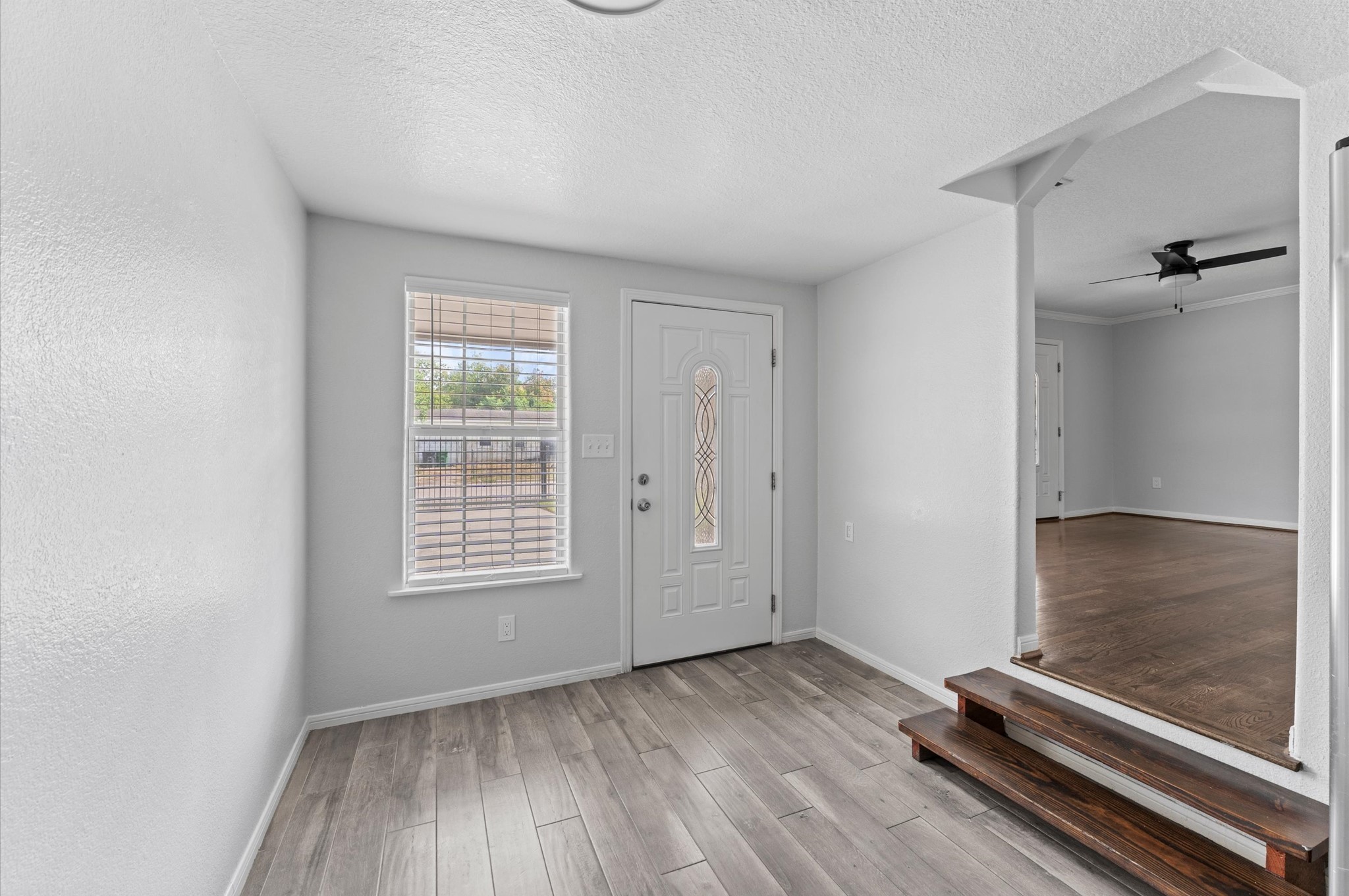 2024 Jean Street Houston, TX 77204 - Photo 8 of 23 an empty room with wooden floor and windows