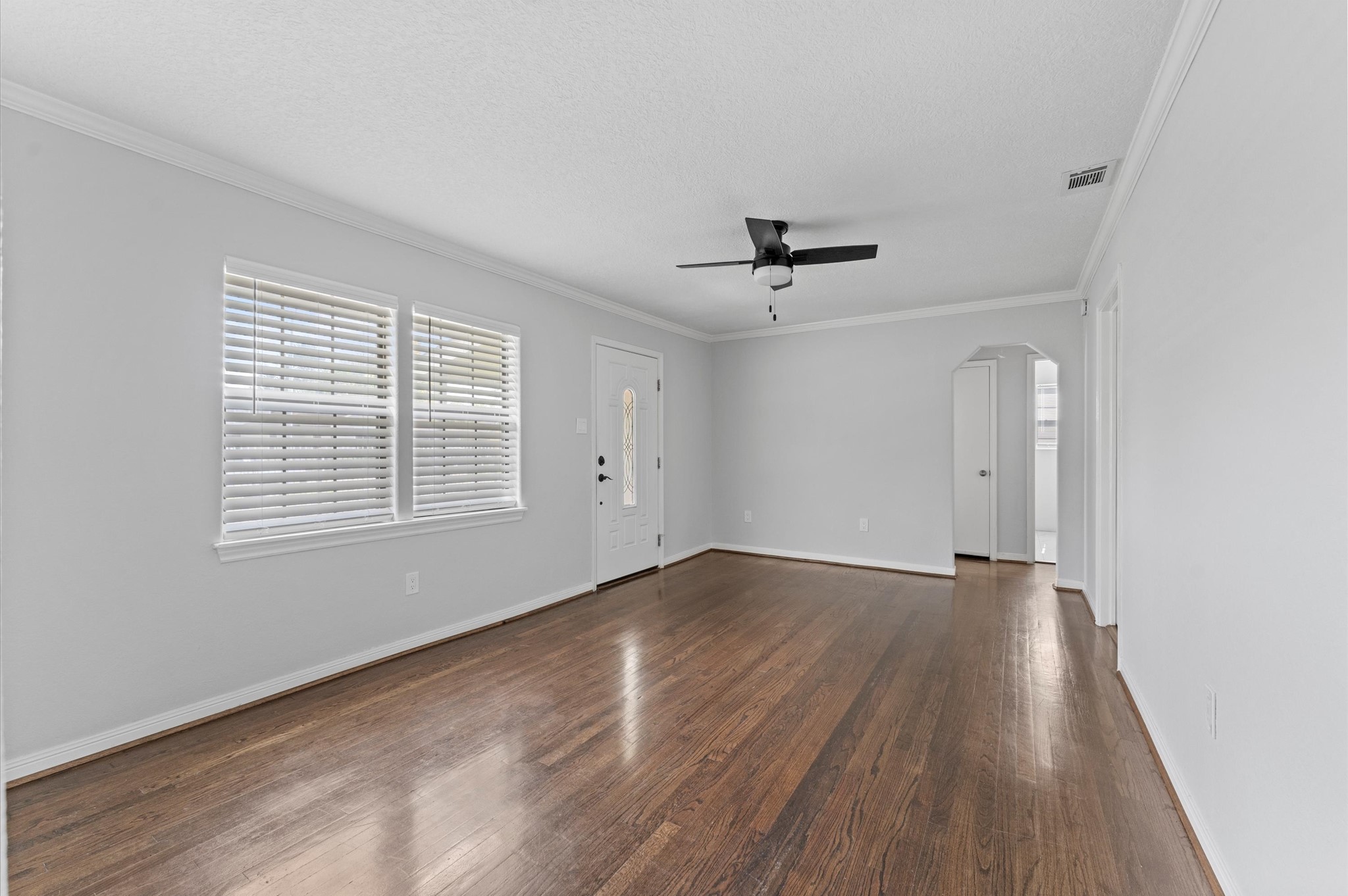 2024 Jean Street Houston, TX 77204 - Photo 10 of 23 wooden floor in an empty room with a window