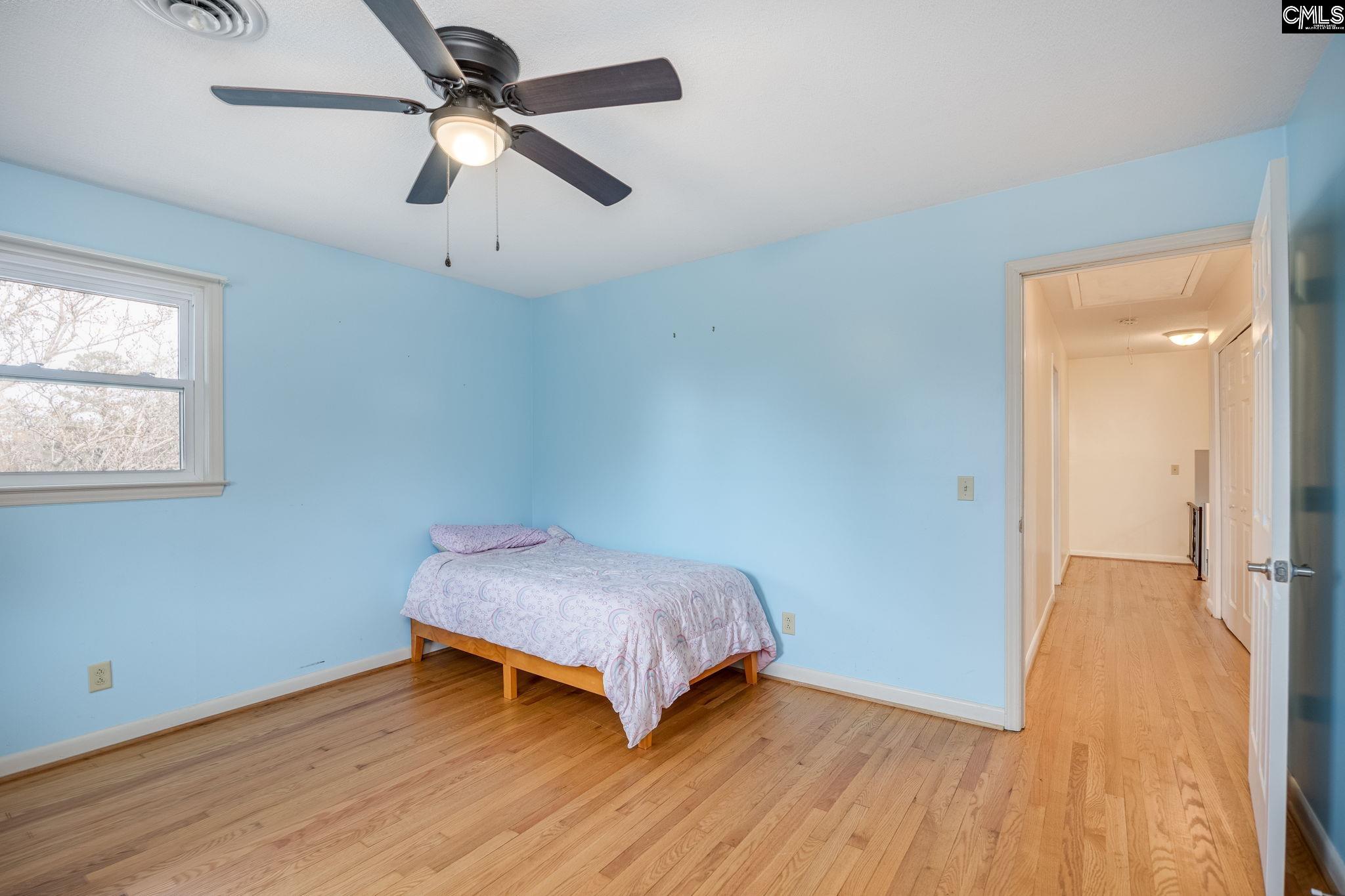 560 Edisto Street Batesburg, SC 29006 - Photo 28 of 49 an empty room with wooden floor fan and windows