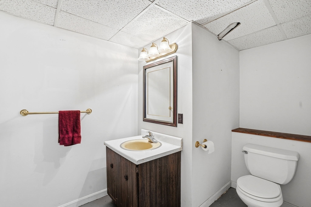 67 Wituwamat Road Weymouth, MA 02191 - Photo 35 of 42 a bathroom with a sink vanity mirror and toilet