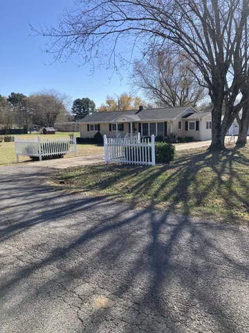 a view of a house with a big yard