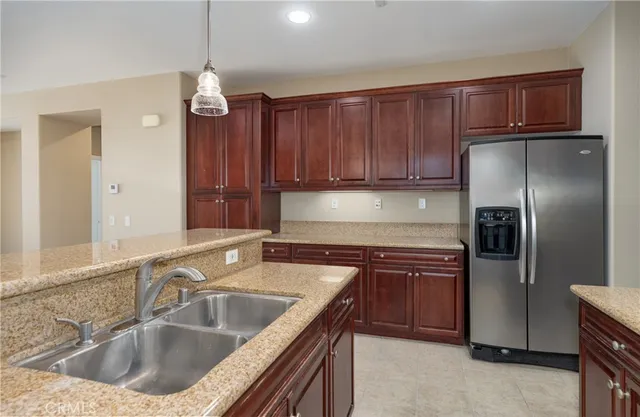 a kitchen with a sink cabinets and stainless steel appliances