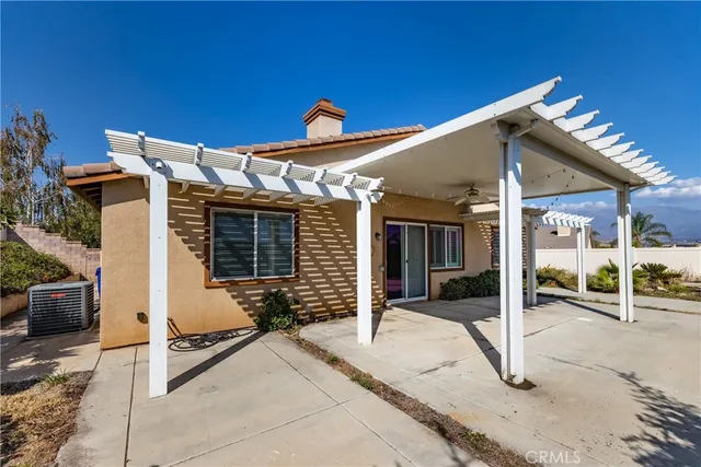 a view of a house with parking space and windows