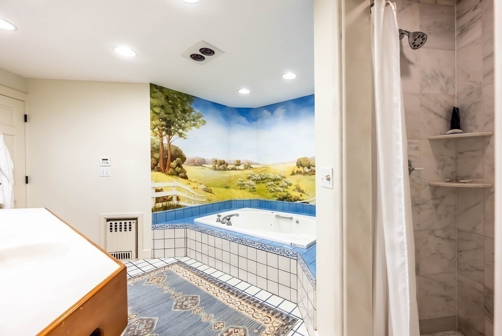 9 A Bancroft Road Andover, MA 01810 - Photo 25 of 37 a bathroom with a bathtub and a shower