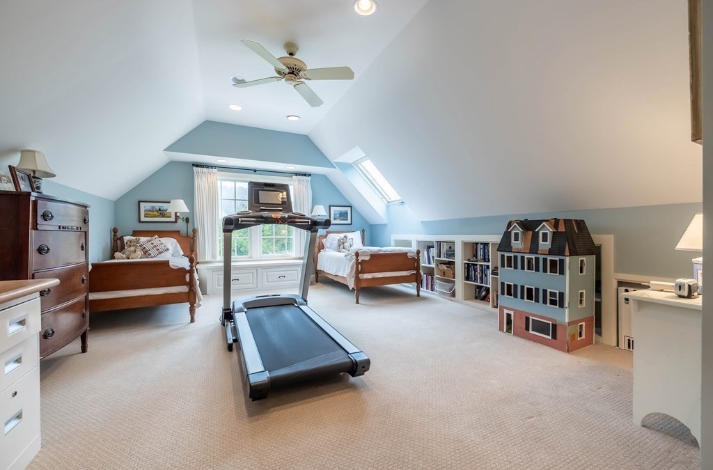 9 A Bancroft Road Andover, MA 01810 - Photo 27 of 37 a living room with furniture and a chandelier