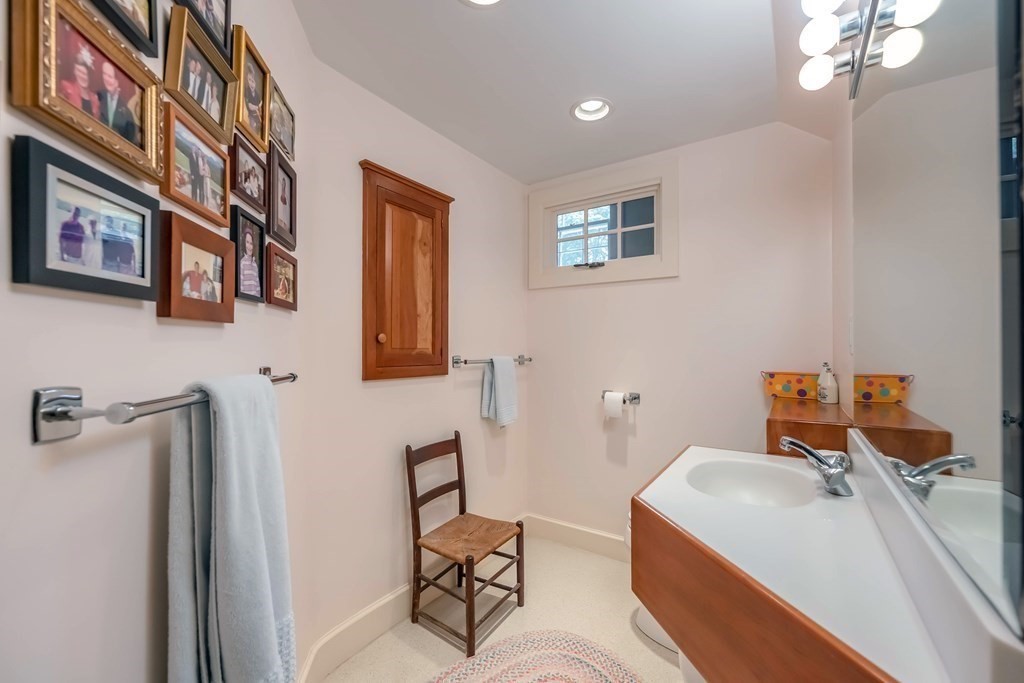 9 A Bancroft Road Andover, MA 01810 - Photo 28 of 37 a bathroom with a sink and a mirror