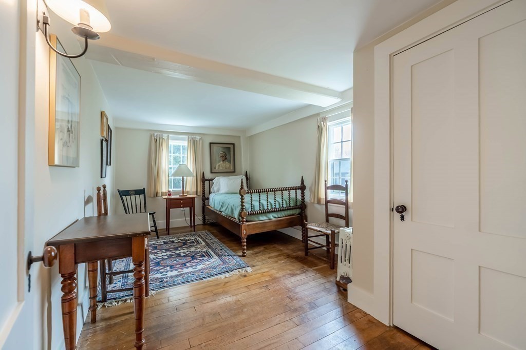 9 A Bancroft Road Andover, MA 01810 - Photo 34 of 37 a bedroom with furniture and a window