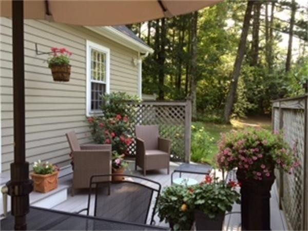 29 Harkness Road Pelham, MA 01002 - Photo 4 of 30 a view of a patio with chairs and potted plants