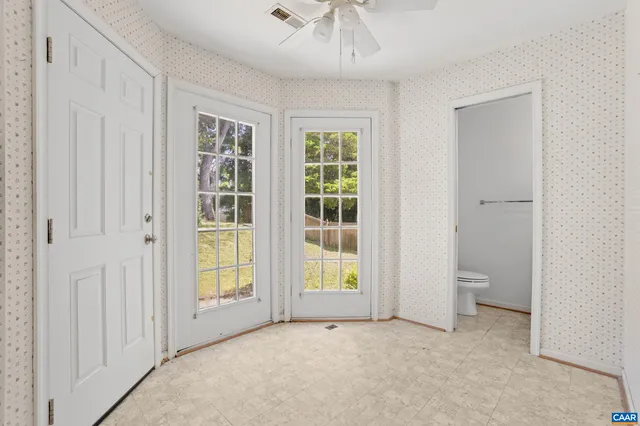 a view of an empty room with a window