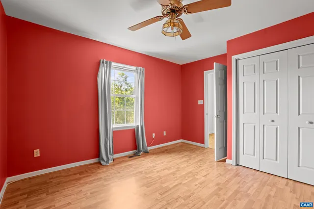 a view of a livingroom with a sofa and a window