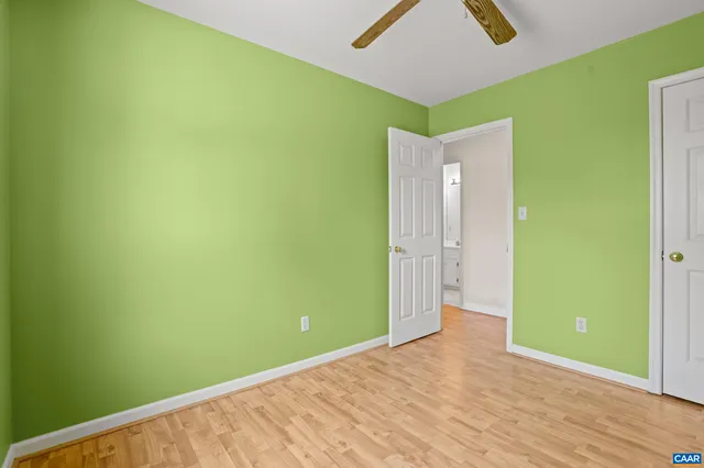 a view of a big room with closet and wooden floor