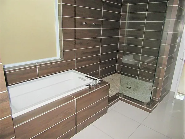 a bathroom with a shower and a sink