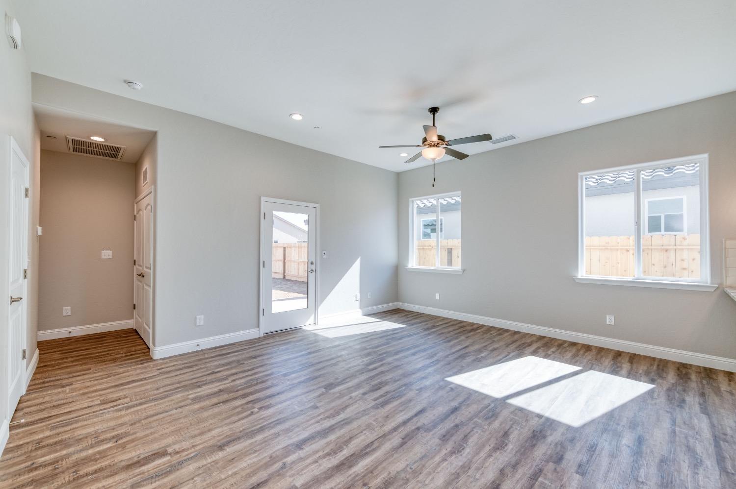 778 Shasta Street Madera, CA 93638 - Photo 13 of 28 a view of an empty room with wooden floor and a window