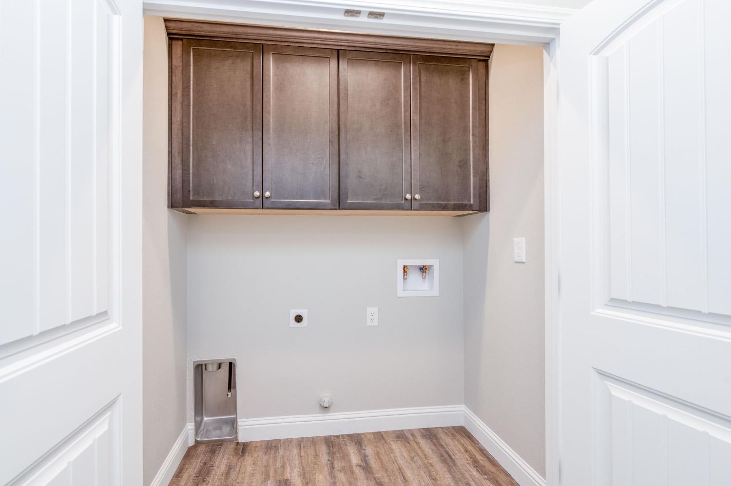 778 Shasta Street Madera, CA 93638 - Photo 15 of 28 a view of storage and utility room with wooden floor