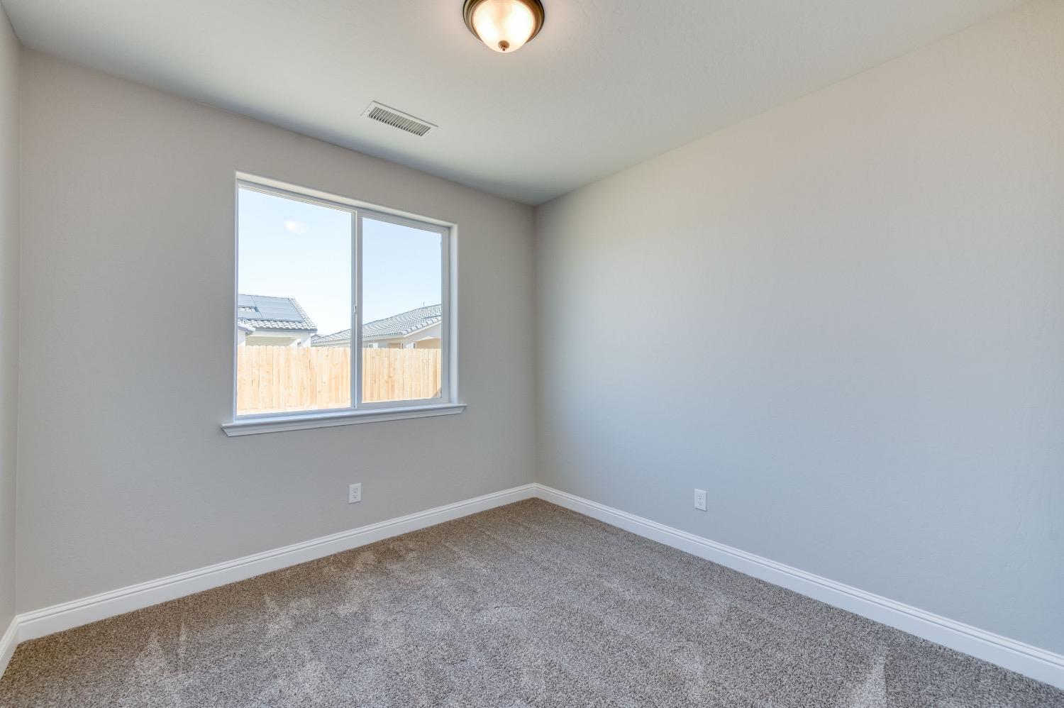 778 Shasta Street Madera, CA 93638 - Photo 19 of 28 an empty room with a window