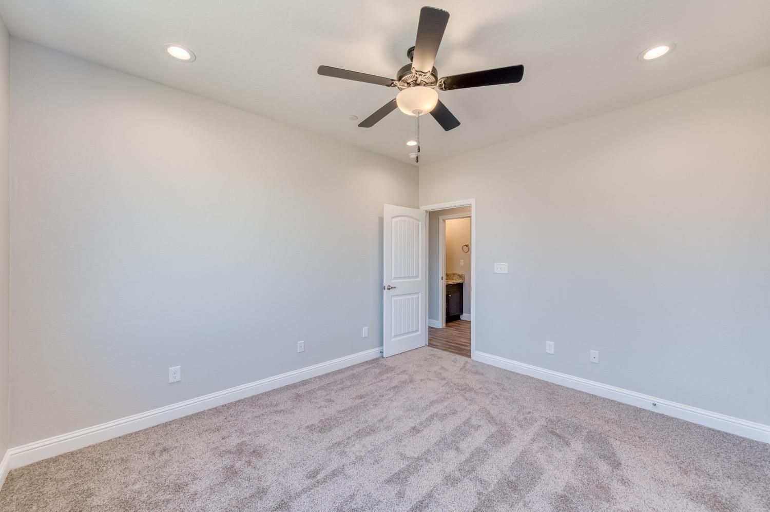 778 Shasta Street Madera, CA 93638 - Photo 20 of 28 en empty room with ceiling fan and window